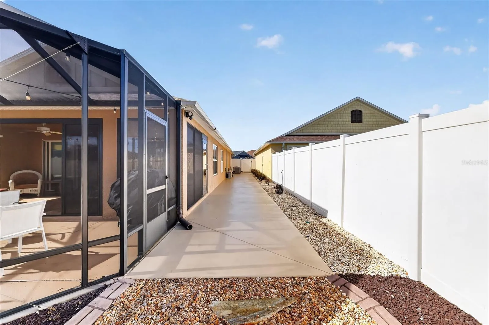 Spacious 68'x7' Side Patio with Privacy Fencing