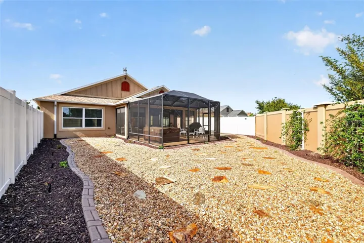 Low-Maintenance Stoned Landscaping with Privacy Wall and ROOM FOR A POOL!