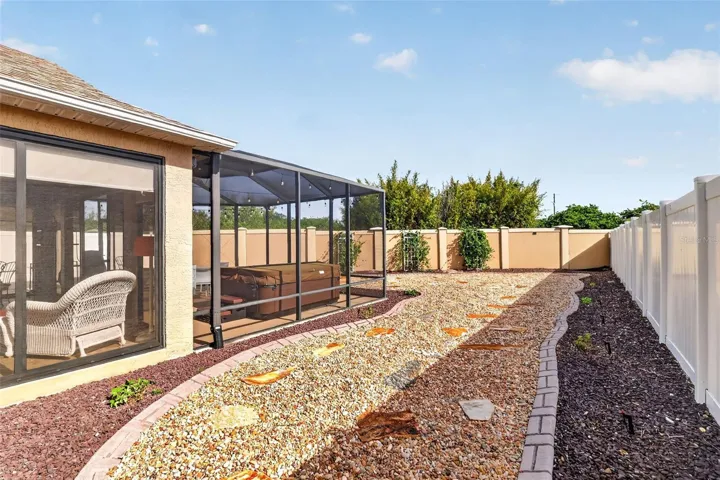 Low-Maintenance Stoned Landscaping with Privacy Wall