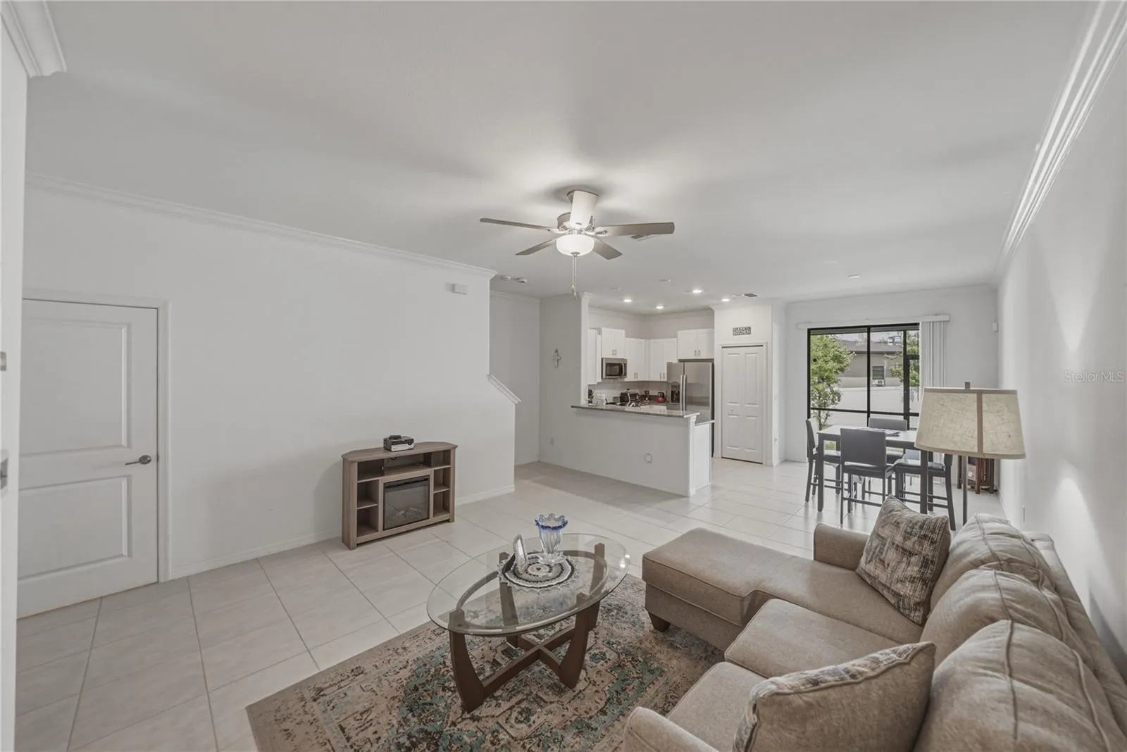 Open Living, Dining and Kitchen with Crown Molding
