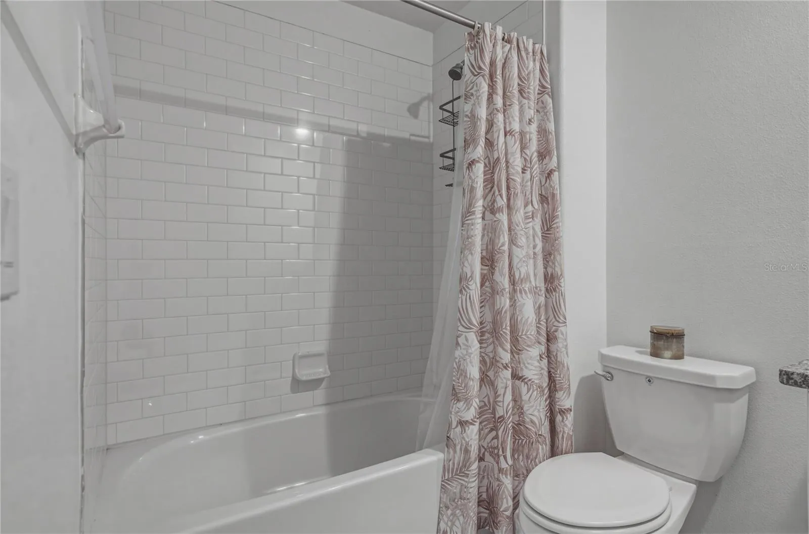 Full Second Bedroom Upstairs with Tile Surround, Square Undermount Sink and Granite Countertops.