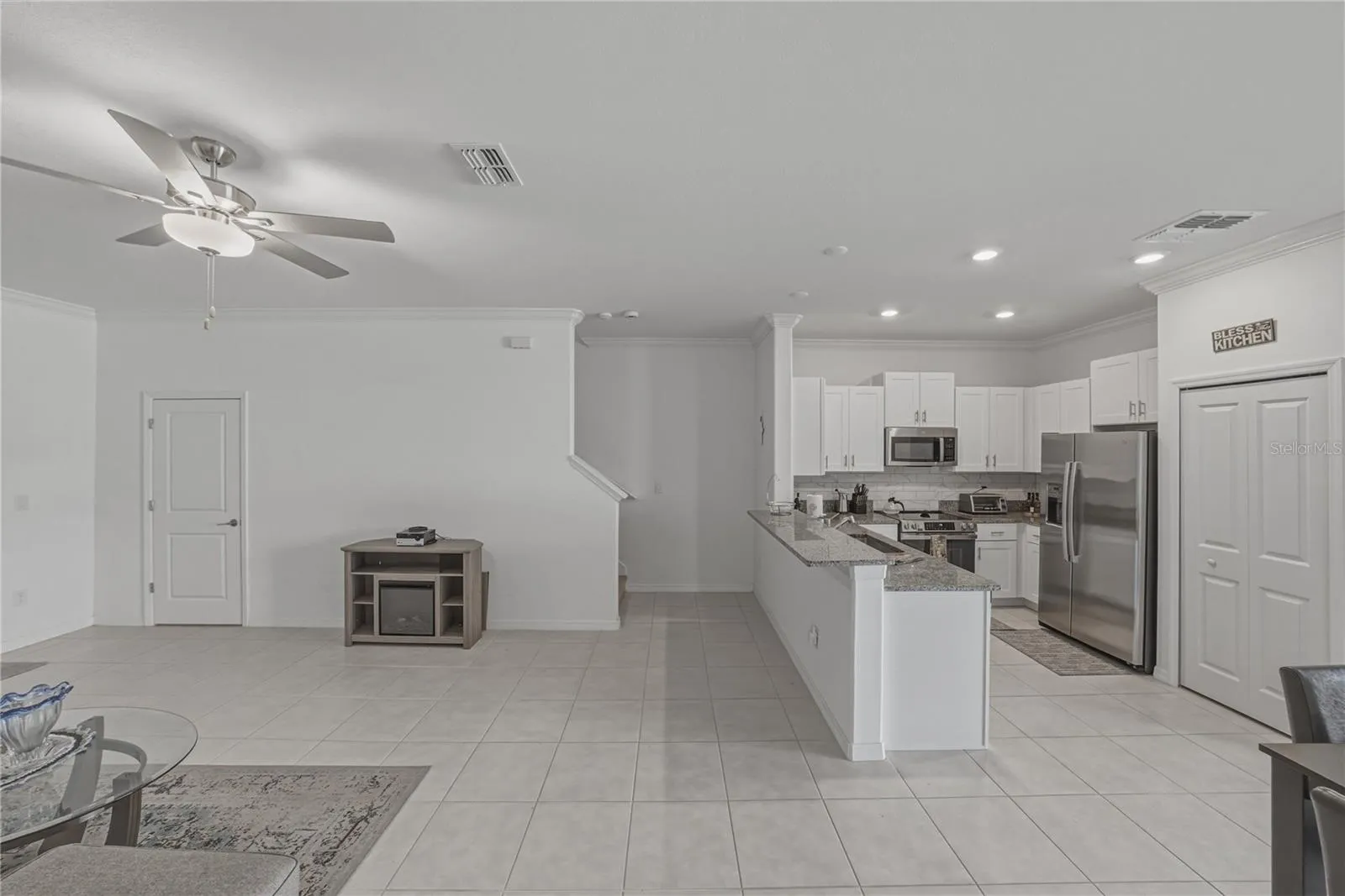 Open Living, Dining and Kitchen with Crown Molding