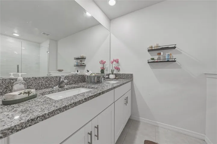 Primary Suite Bath with Dual Undermount Sinks, Granite Countertops, Full Overlay Shaker Cabinets and Hardware