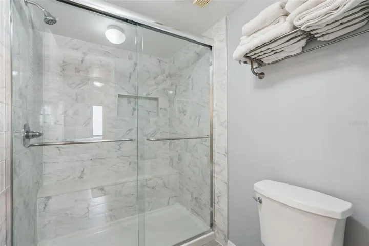 Primary Bathroom with Walk-in shower and seat