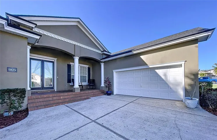 Front & Garage Entry with large parking pad.