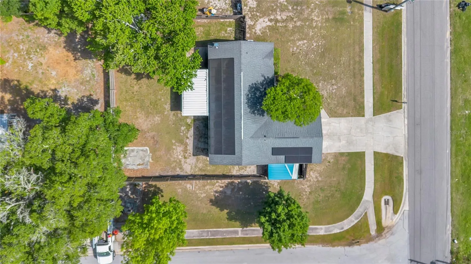 Aerial of Home and Corner Lot with Sidewalks