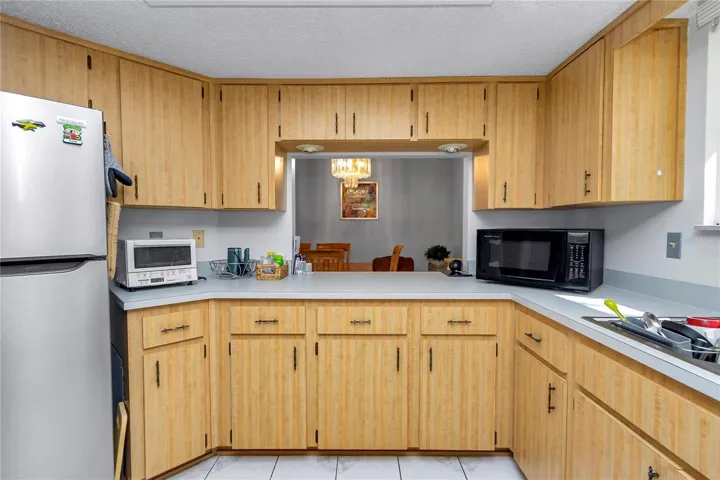 KITCHEN WITH PASS THRU TO DINING AREA