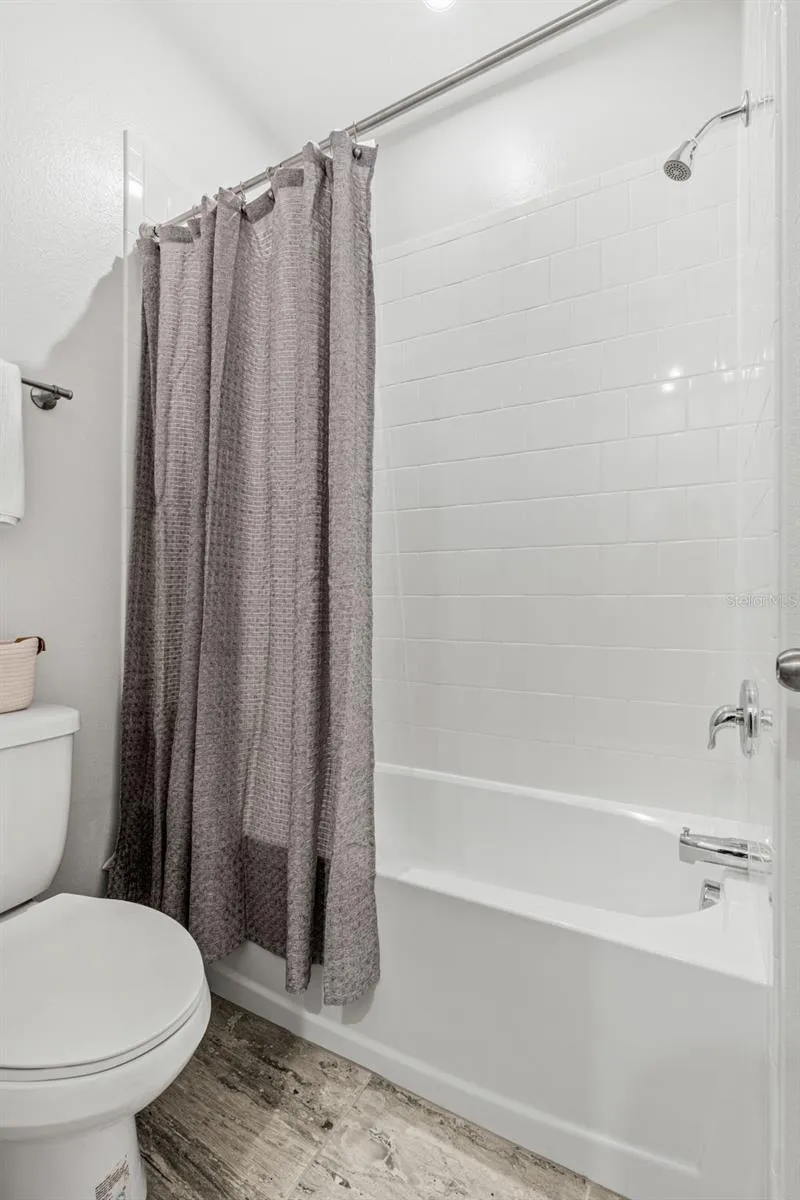 View of Shower/Bath Combo in Jack in Jill bathroom