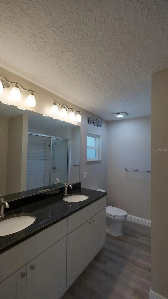 Primary Bath with Double sinks, Shower, and Large Linin Closet
