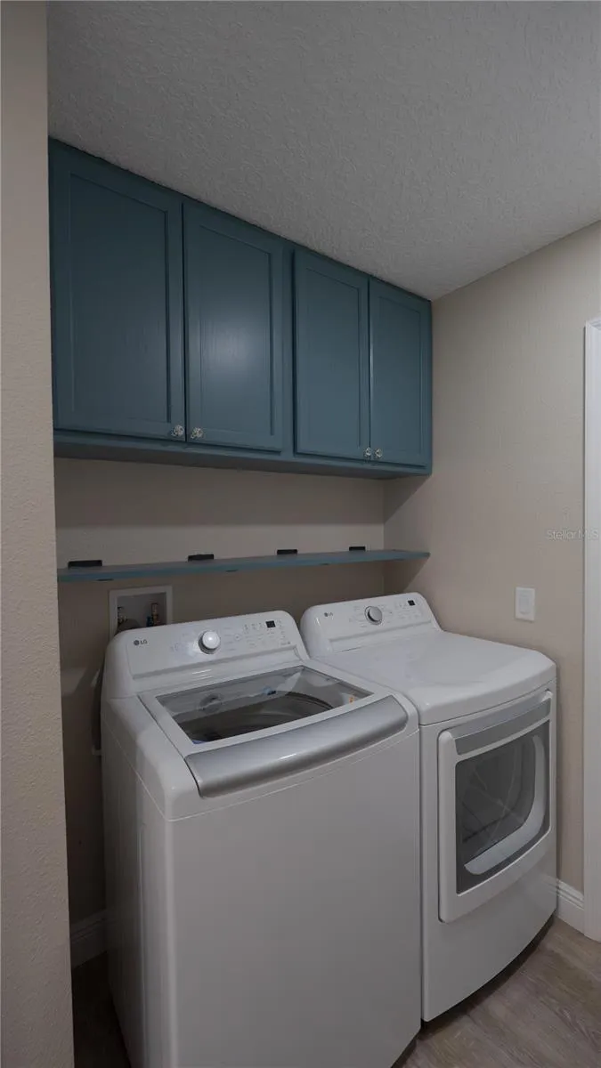 Laundry Room with Washer and Dryer and overhead Cabinetry