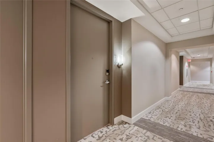 Welcome to unit 519. Wide hallways with modern decor.