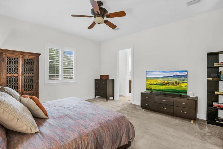 Spacious primary suite with en suite bathroom and walk-in closet