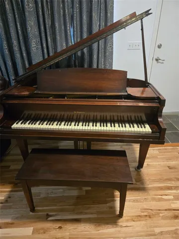 Owners will leave or move baby grand piano, whichever new buyers want.