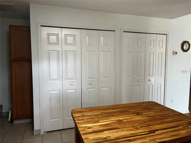 Plenty of pantry storage here and washer and dryer included in left closet