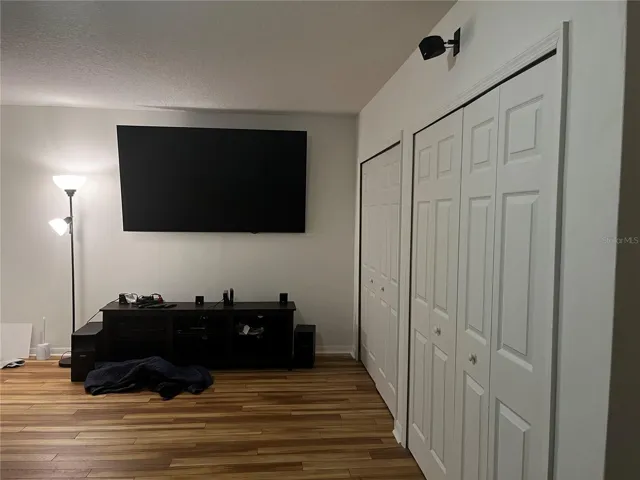 Beyond the kitchen is the 21' x 23 Flex Room with 1/2 bath (room to add shower) and several good sized closest. Used as 