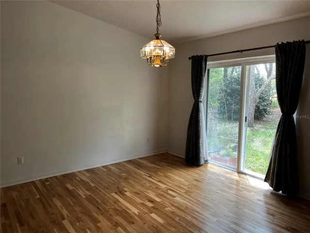 Dining area overlooks back of property.