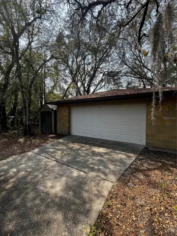 To the right of house, the large, extended depth 24' x 24' detached garage. Generator is included.