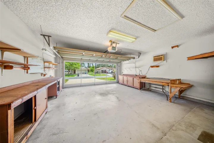 2-Car Garage with built in carpentry and storage