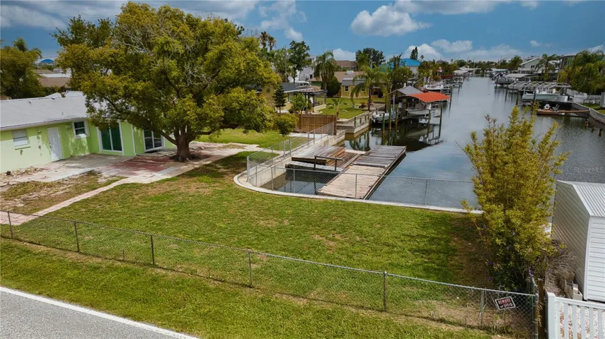 Amazing backyard green space is a definite bonus in this boating community