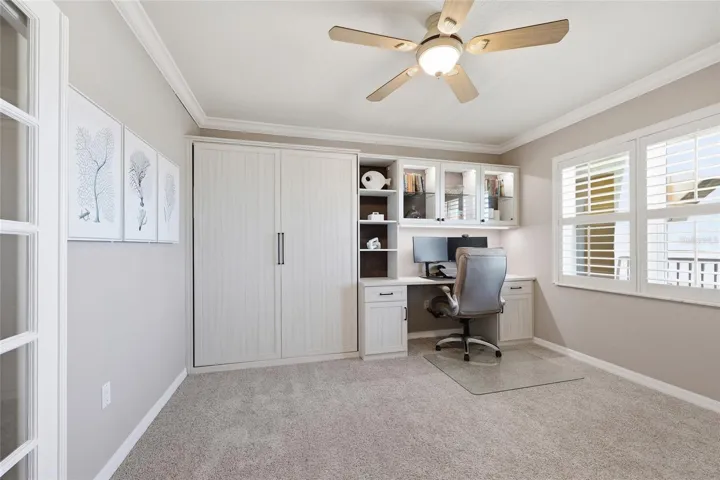 Third bedroom has custom murphy bed & work space