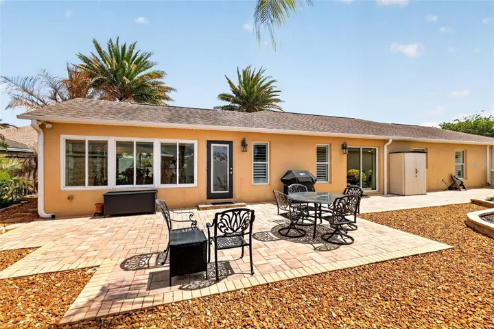 Spacious Side Paver Patio with Enhanced Stoned Hardscaping