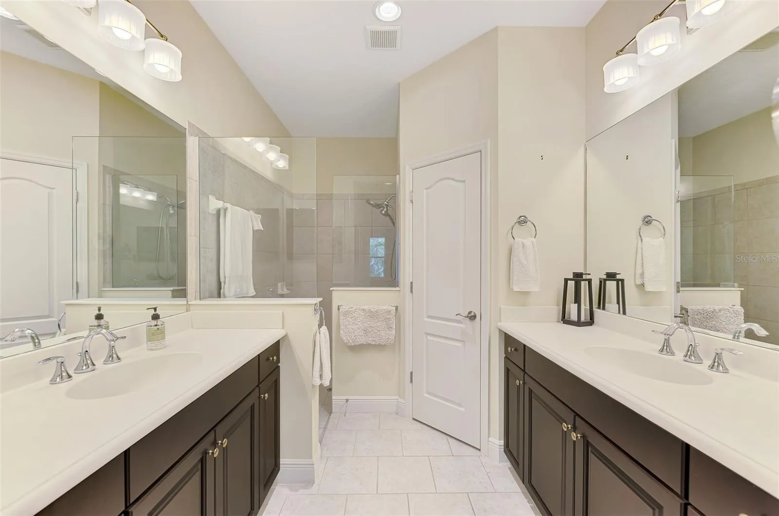 Dual-sinks in Primary Bathroom with walk in shower.