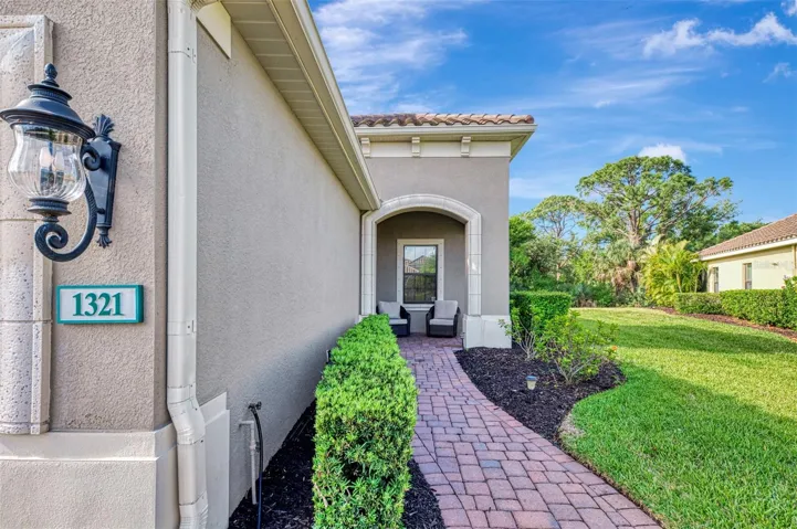 Front of Villa, paver walkway, sitting porch.