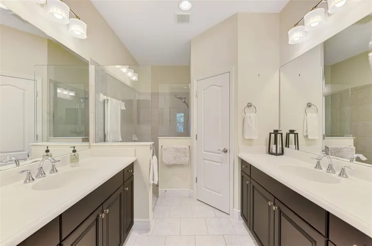Dual-sinks in Primary Bathroom with walk in shower.
