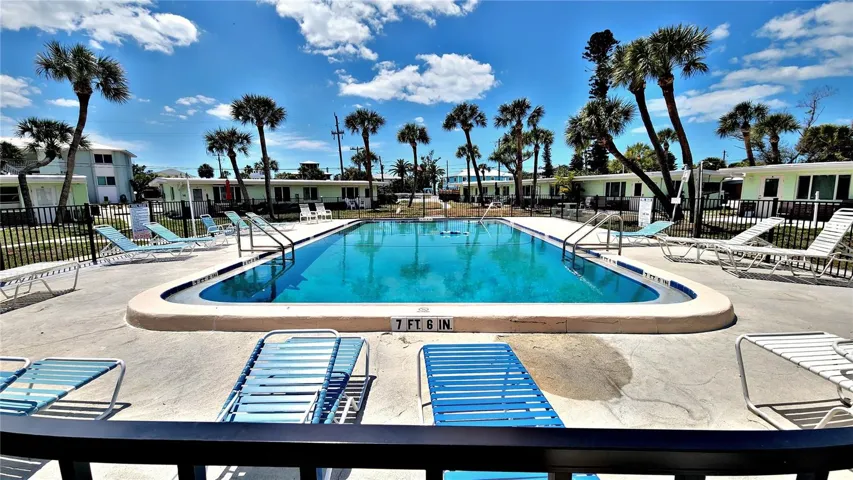 LARGE HEATED FENCED POOL WITH PLENTY OF SEATING