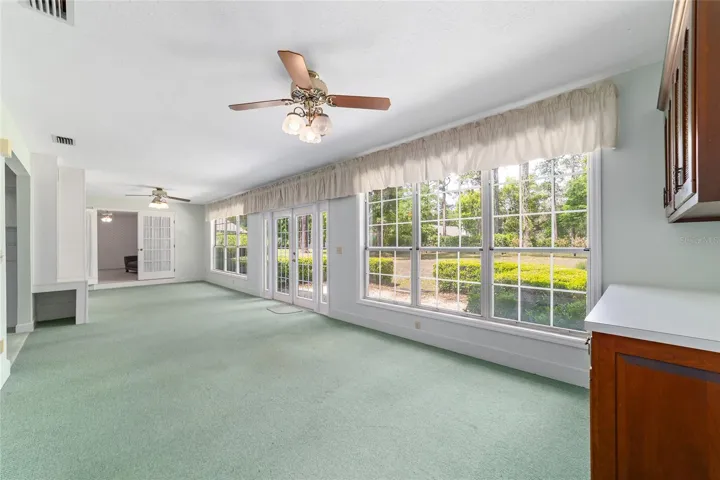 Florida room w/ lovely views from wall of windows