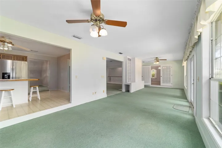 Florida room near kitchen toward primary