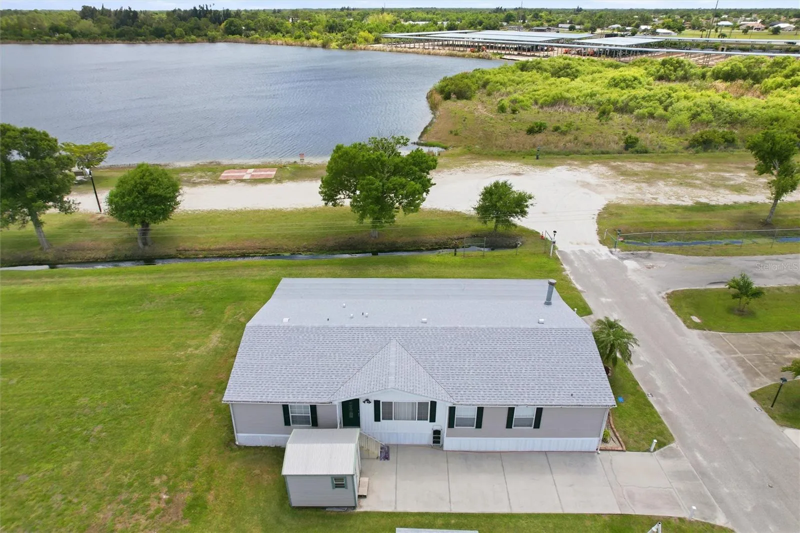 Aerial of home with access to 34 acre lake