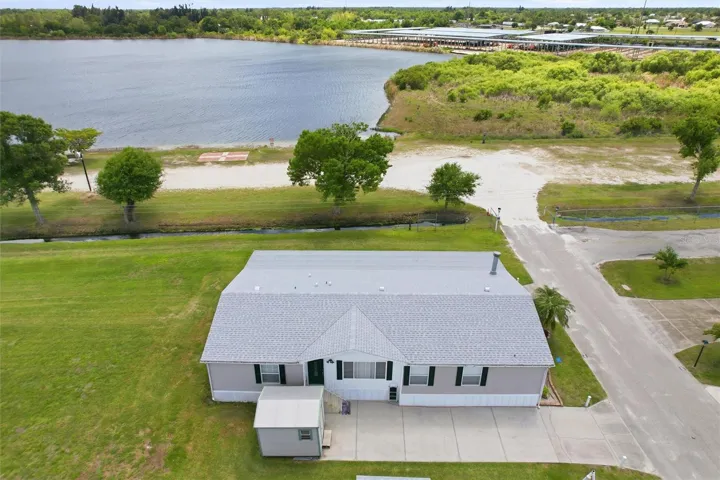 Aerial of home with access to 34 acre lake
