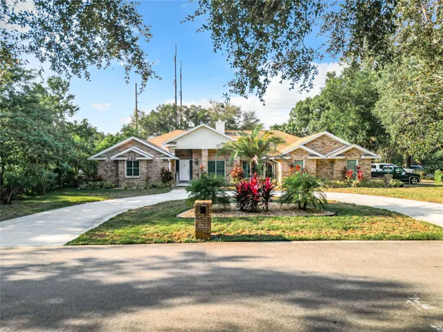 Front circular driveway leads to estately entry