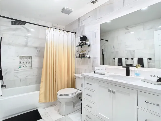 Upscale hallway marble bathroom