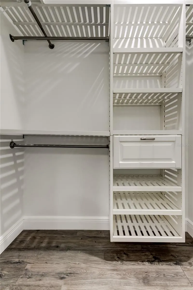 Walk-In Closet in Owner's Retreat - Designed Focus = Maximum Storage, by a Professional Organizer! For ALL Your Shoes &amp; Clothes!