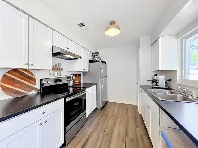 Kitchen equipped with refrigerator, range, microwave & air fryer