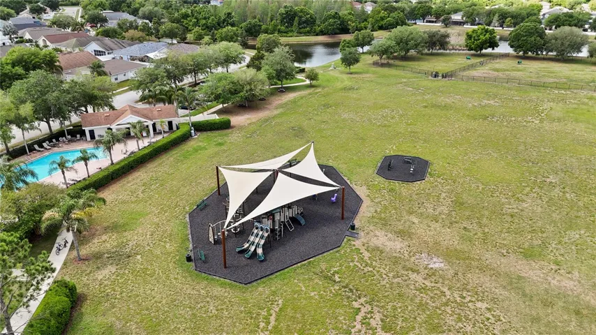 The communitey features a covered playground for kids fun along with the community pool and large grounds.