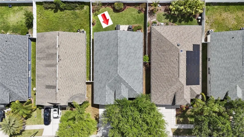An aerial view of neatly maintained homes in a quiet community.