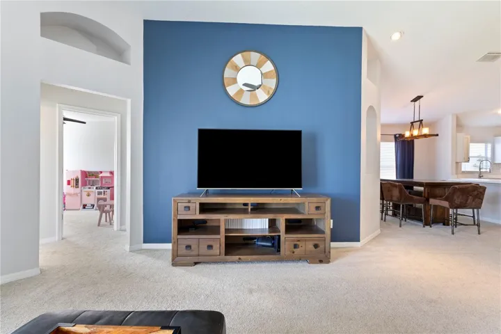 Wow! The architectural details in the walls highlight your family living space that opens to either the kitchen and dining gathering area, or the hallway to the 2 extra bedrooms!