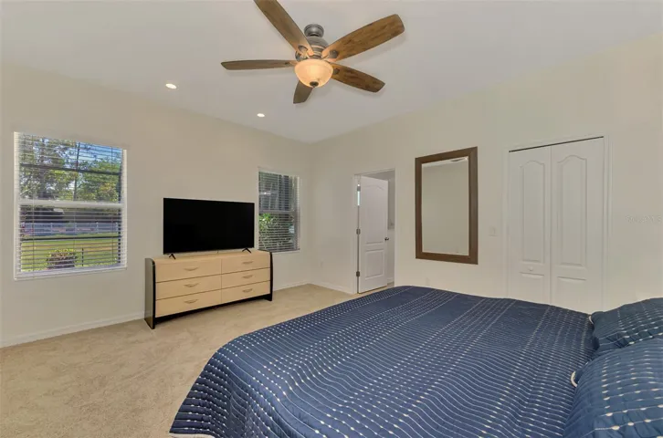 Primary Bedroom with views to Over-sized, Fenced Back yard. Walk in Closet.