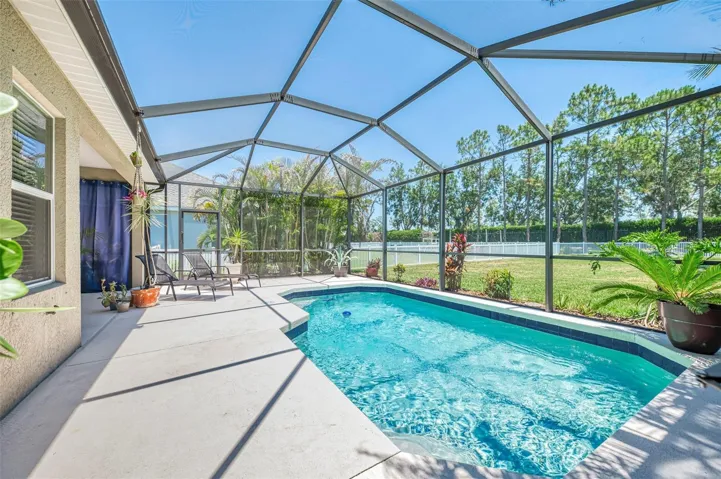 Screened lanai for pool and outdoor entertaining.