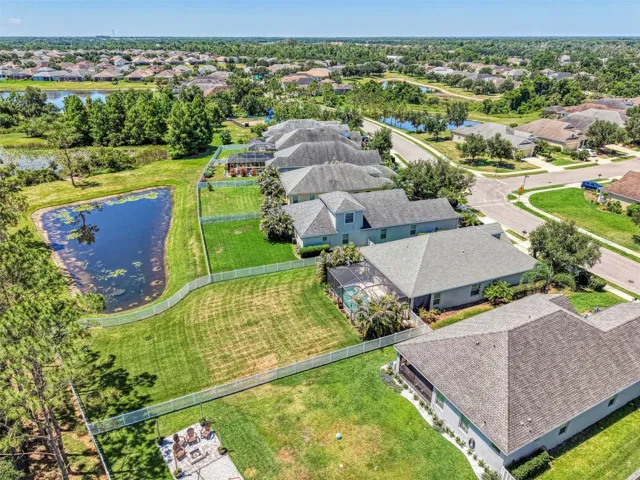 Oversized, fenced back yard with pond views. 3 Bed, 2 Bath, POOL Home in Manatee County. Parrish, FL.