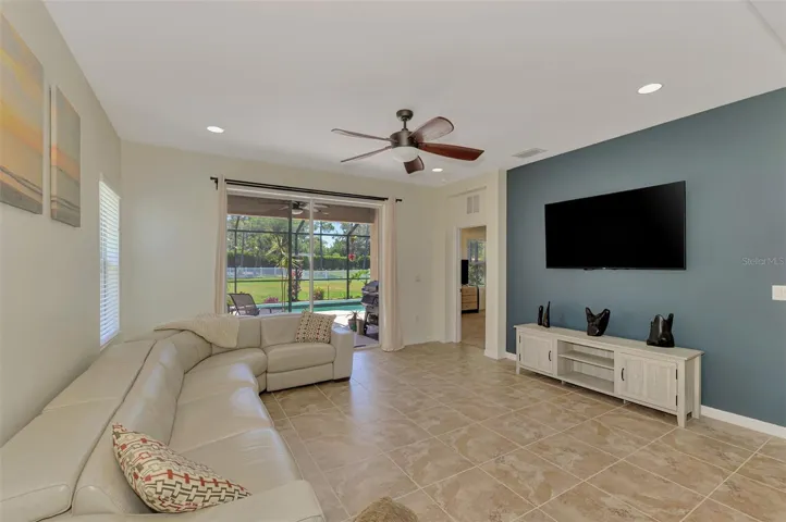 Living Room view to POOL and Over-sized FENCED Backyard. Rivers Reach. Parrish, FL