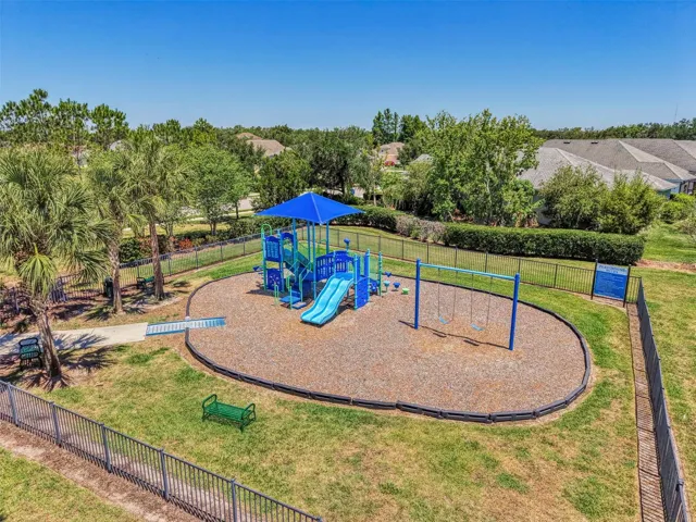 Fenced and shaded neighborhood playground in Rivers Reach, Parrish, FL.