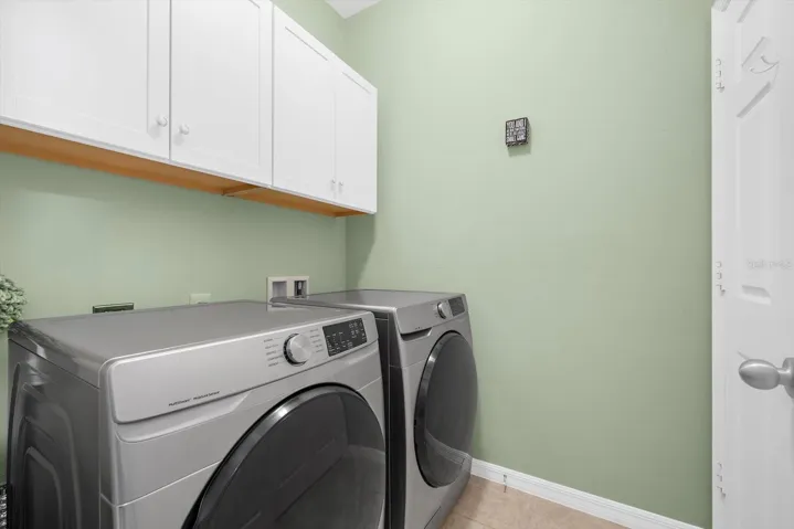 Laundry Room with overhead cabinets