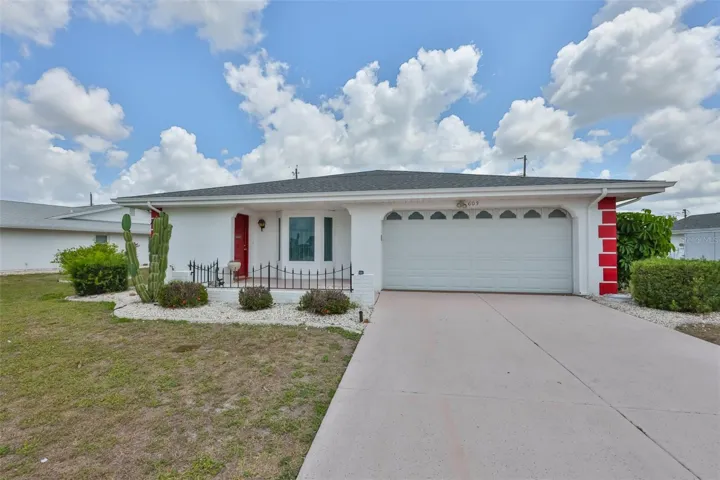 NEW ROOF on this 2 bed 2 bath 2 car garage home with Sunroom addition