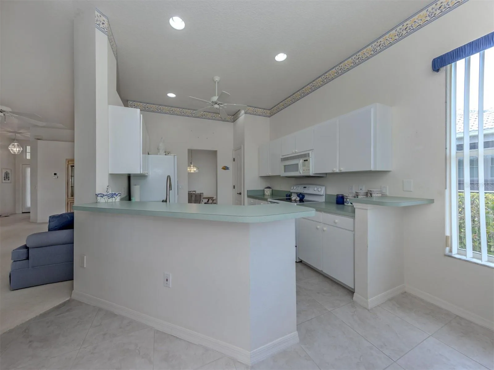 White kitchen cabinets, just replace handles and install a new countertop and you will complete your kitchen