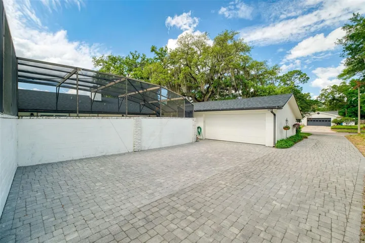 Pavered motor court and access to double garage