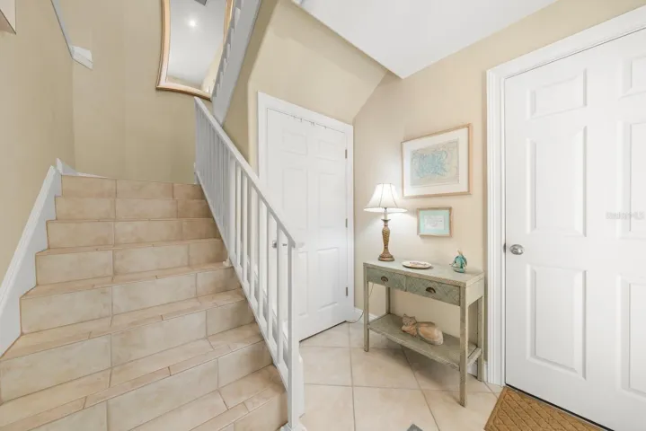 Private, interior stairs. Illustrating garage door and storage closet.